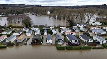 Dozens rescued as rain leads to flooding and travel is disrupted in parts of the UK