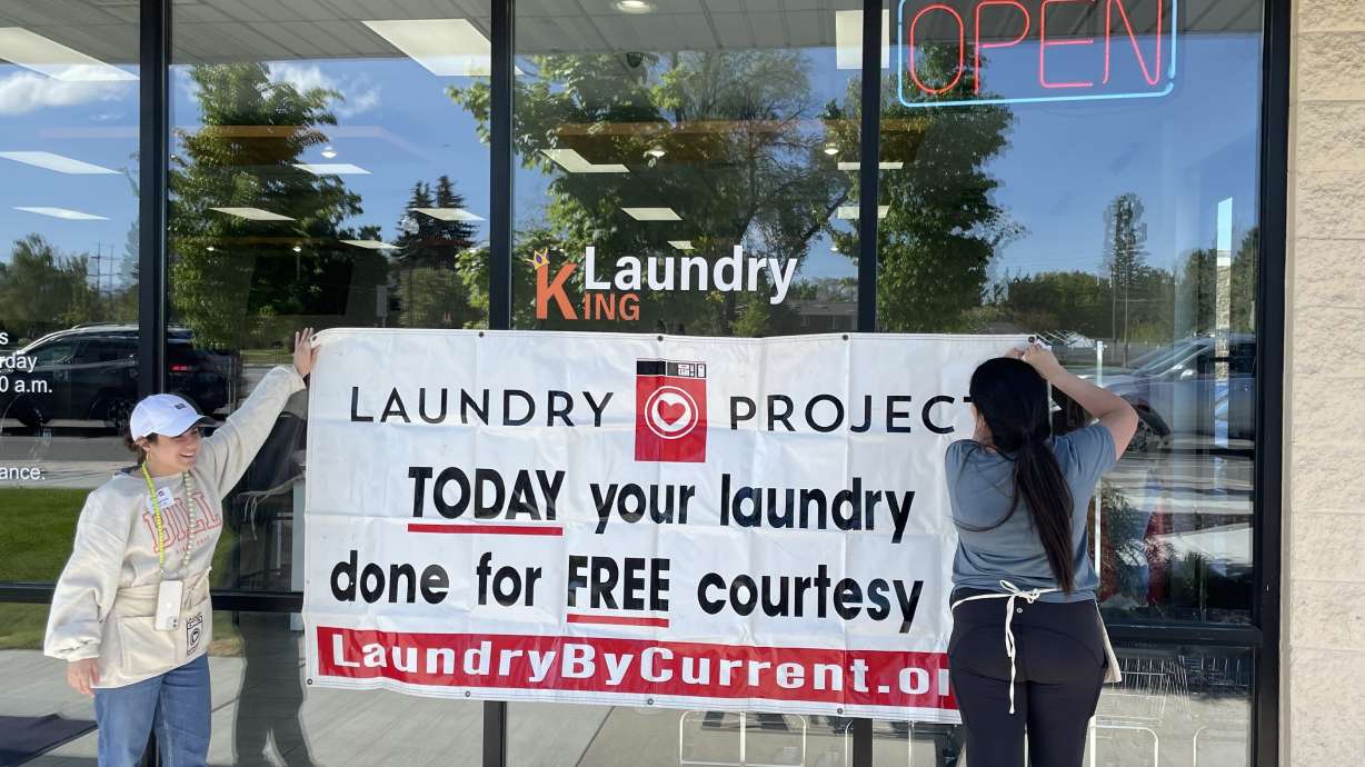 Nonprofit sponsors free service at laundromat to lighten the load for a day