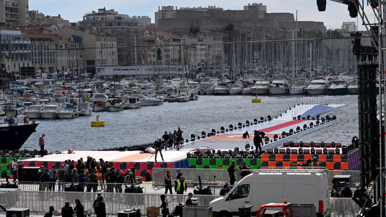 High security and fanfare welcome OIympic flame to port city of Marseille