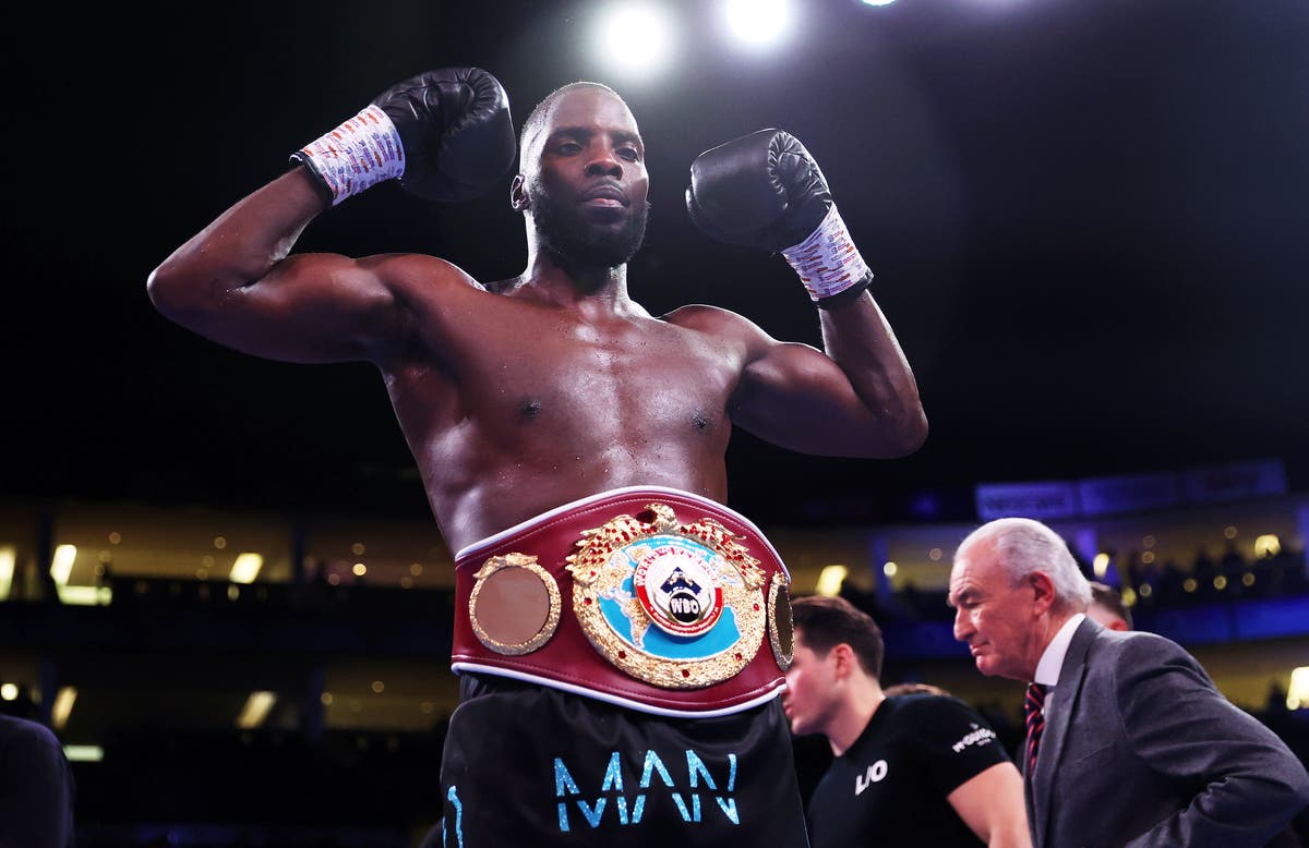 Lawrence Okolie wins bridgerweight world title with ruthless first-round victory over Lukasz Rozanski