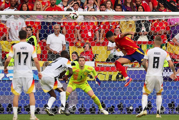 Spain beat Germany in overtime thriller to book semis