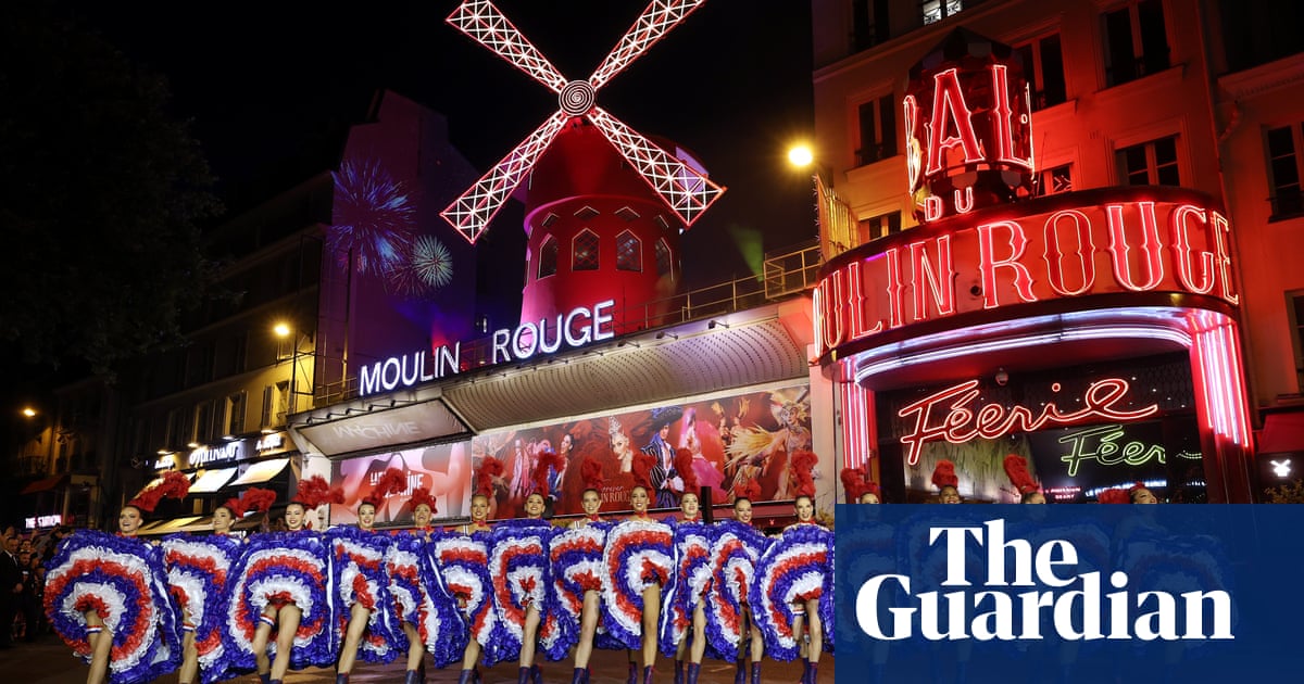 Moulin Rouge in Paris celebrates installation of new windmill sails