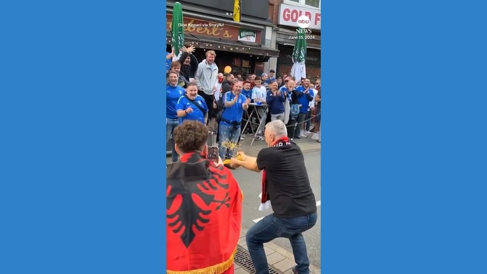 WATCH: Albania fan playfully taunts Italian supporters by snapping spaghetti