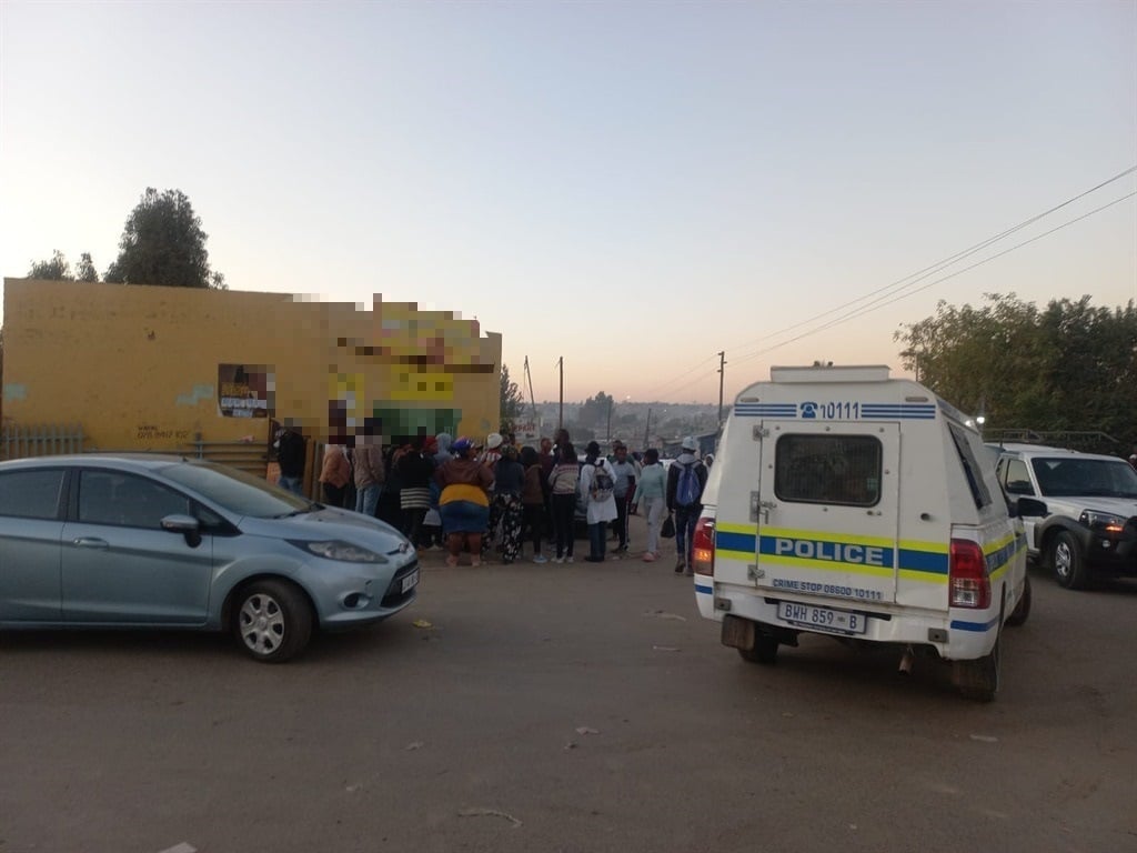 Diepsloot residents camp outside tuck shop as owner is held for allegedly raping six-year-old girl