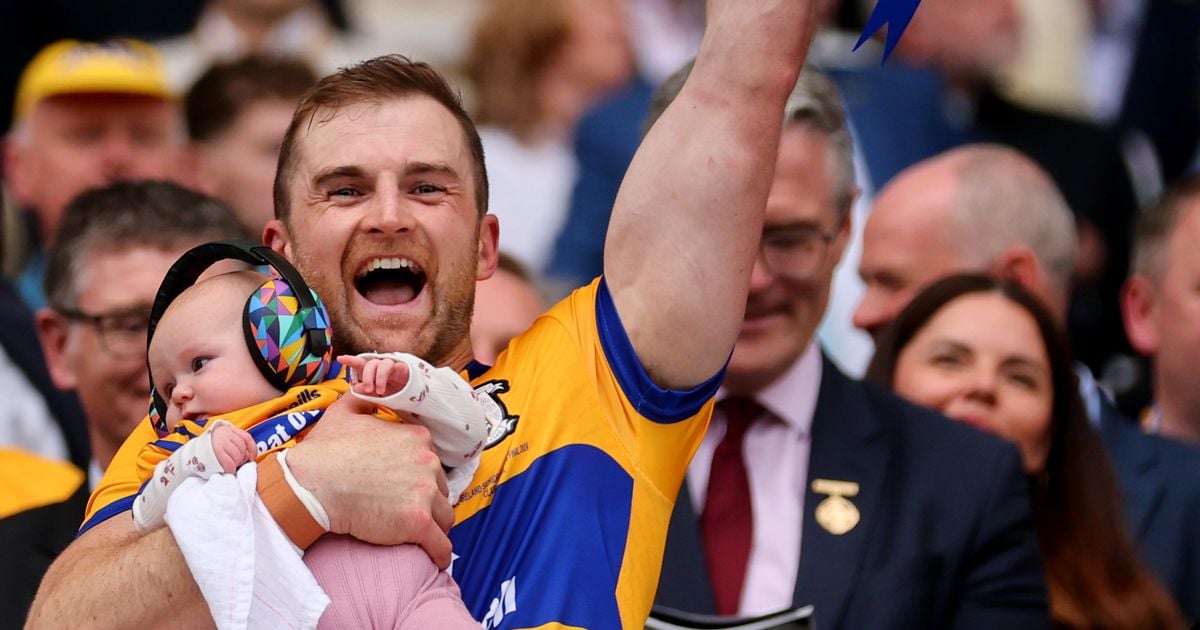 Seadna Morey celebrates Clare's All-Ireland win by lifting Liam MacCarthy Cup with baby daughter