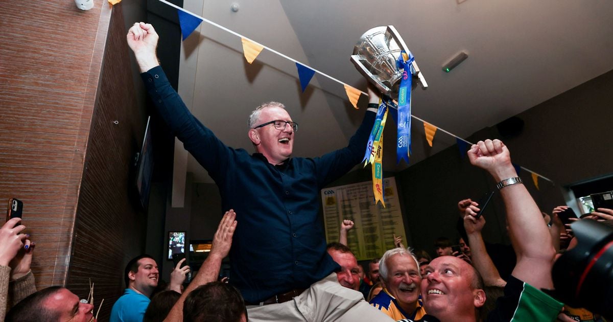 Clare manager Brian Lohan carried aloft as he brings Liam MacCarthy Cup to home club 