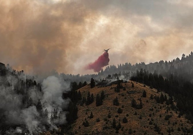 Western U.S. battles massive wildfires triggering evacuations, health alerts