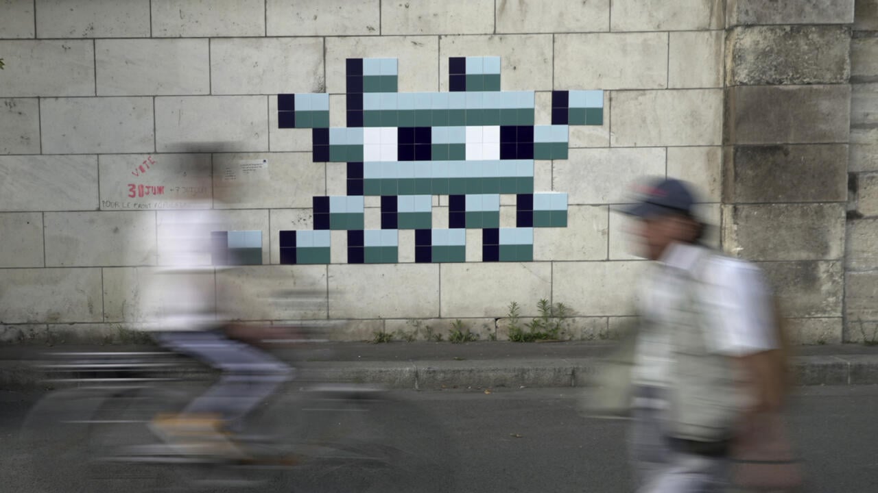 Mystery Paris street artist 'Invader' creates new work to celebrate Olympics, delight fans