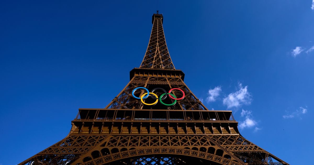 Eiffel Tower evacuated as man seen climbing landmark hours before Olympics closing ceremony arrested