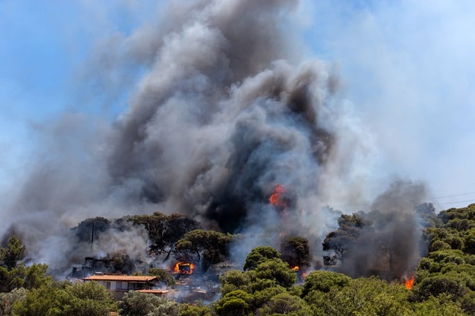 Raging fire forces more evacuations in Greece