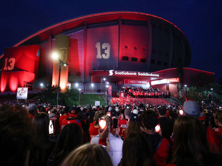 Fans gather at candlelight vigils for Gaudreaus in Calgary, Columbus