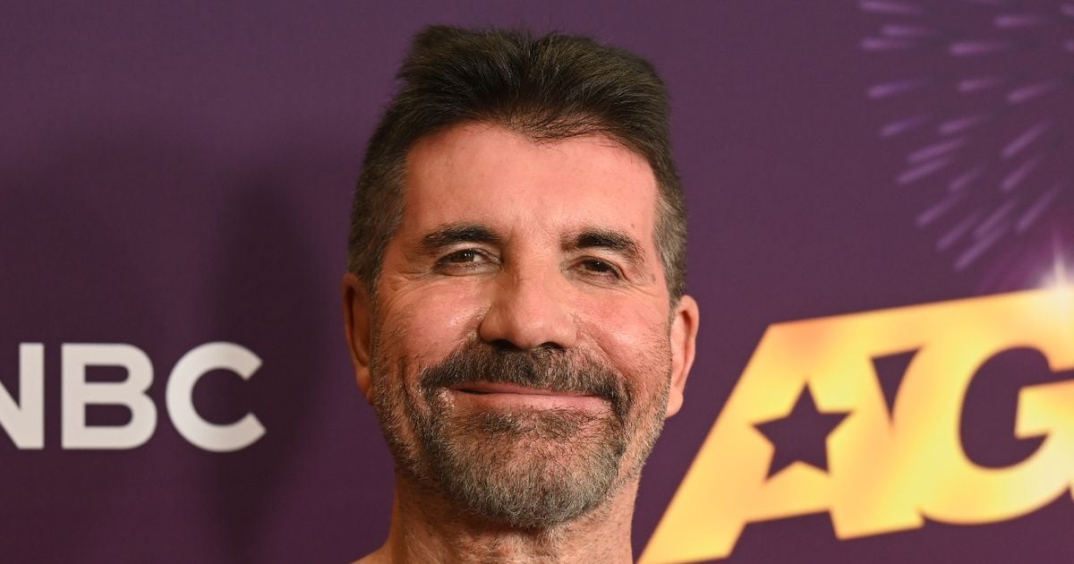 Simon Cowell looks the proud dad as he's joined by lookalike son Eric, 10, on red carpet