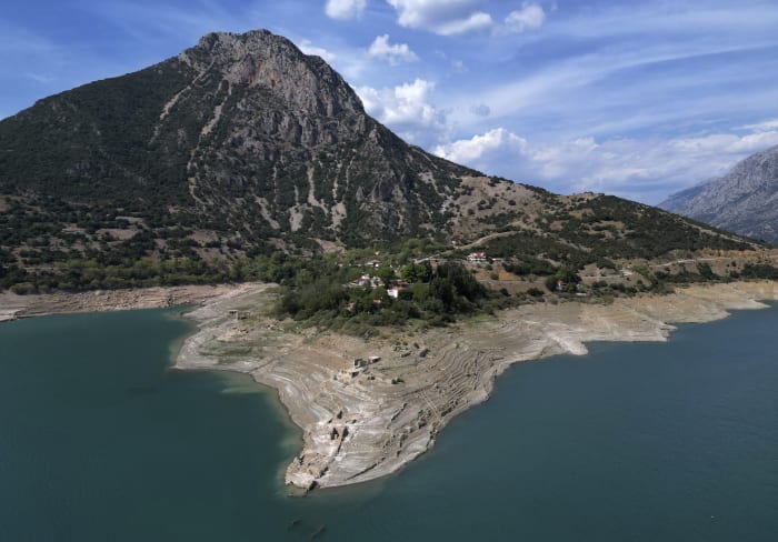 Ruins of a long-sunken Greek village emerge as drought saps a vital reservoir