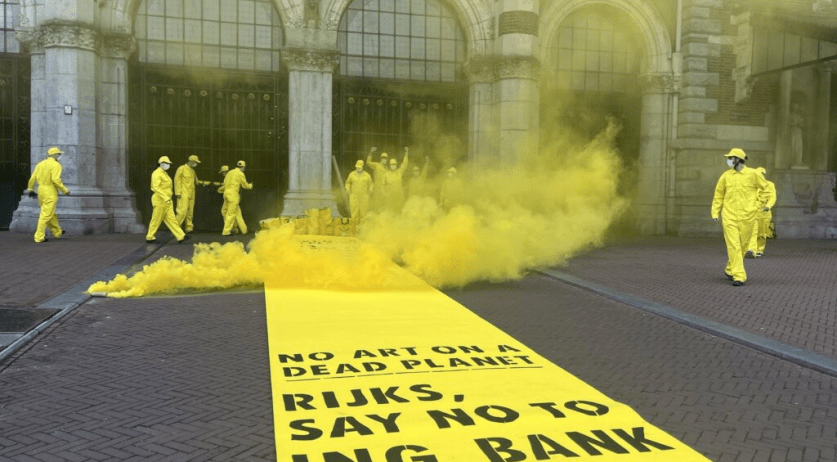 Extinction Rebellion activists chain themselves to fences at Rijksmuseum entrance