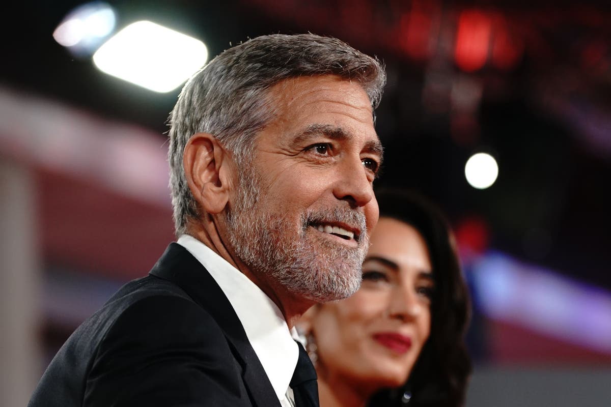 George Clooney plays photographer at star-studded charity event