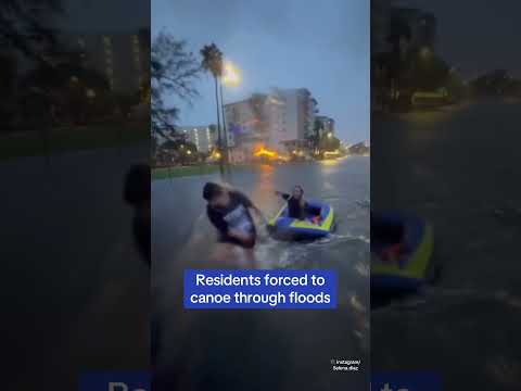 Tampa residents drag canoe through flooded streets as Hurricane Helene slams Florida