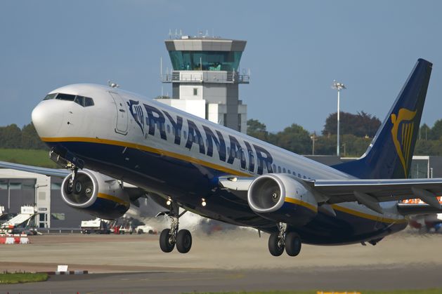 Ryanair flight abandoned and passengers evacuated after plane catches fire