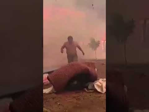 Harrowing moment man salvages belongings from burning home