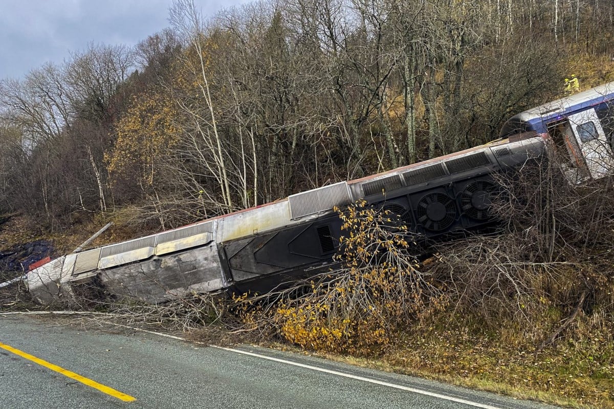 Train carrying at least 50 people derails on Norway's north coast, killing at least 1 person