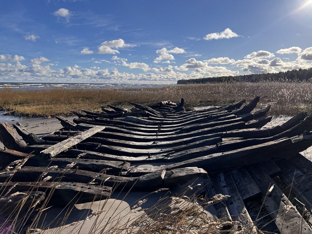 Intriguing wooden shipwreck washed up on Latvian beach