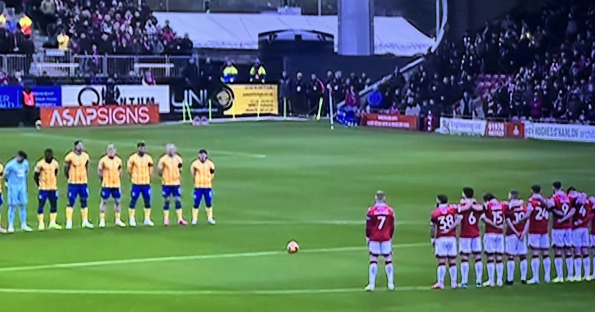 James McClean stands apart from teammates during Remembrance silence