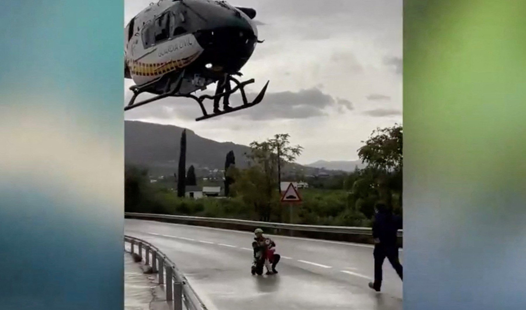 Helicopter crew rescues child from house in flood-hit Spain