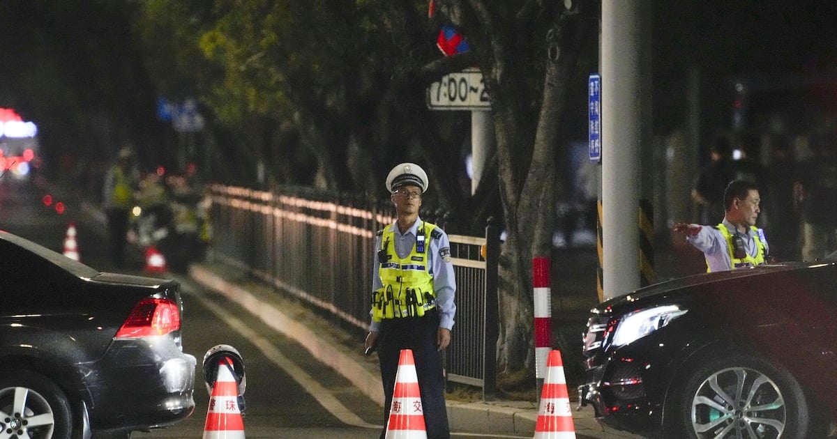 At least 35 people killed in southern China after car driven into crowd outside sports stadium 