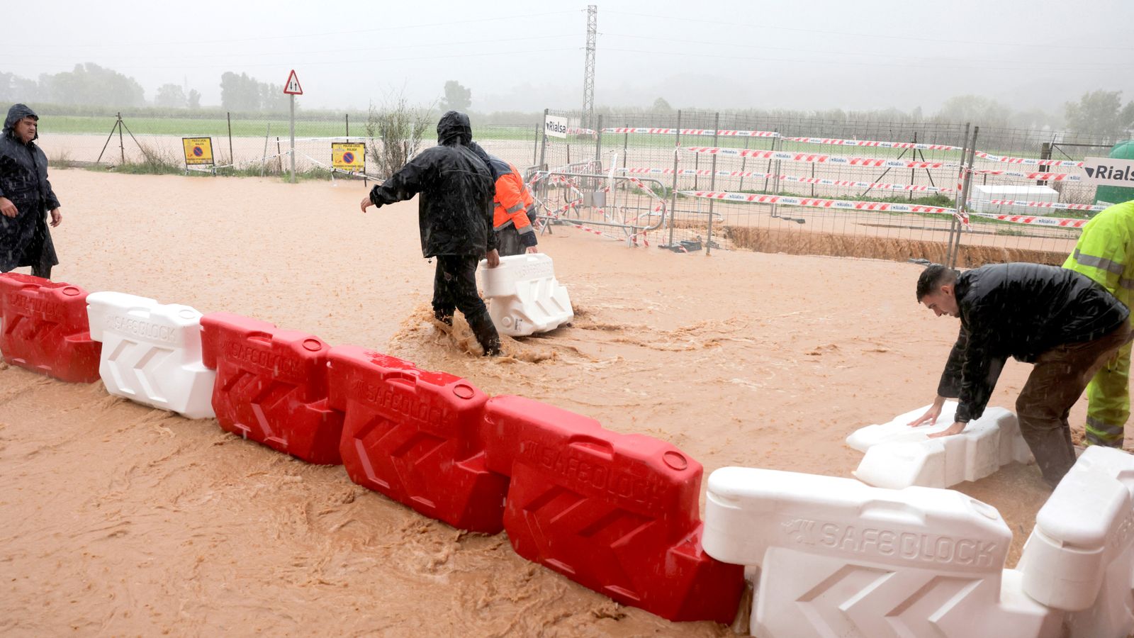 Thousands evacuated in Spain as residents cover cars in plastic wrap - just two weeks after floods killed 220