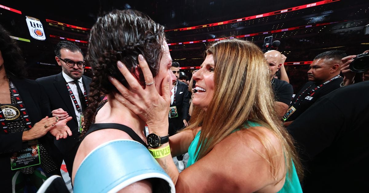 Katie Taylor embraced by her mother Bridget after win over Amanda Serrano