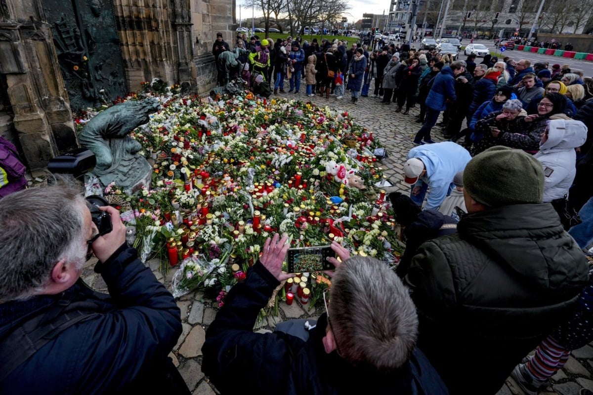 Germans mourn the 5 killed and 200 injured in the apparent attack on a Christmas market