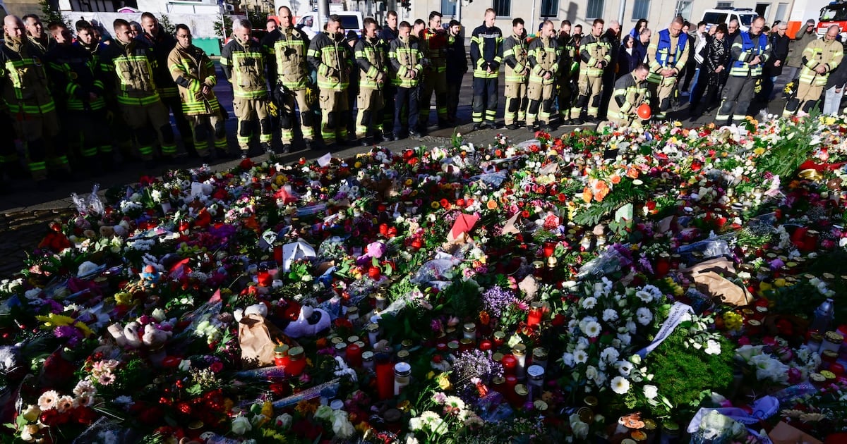 Flowers, candles and a deathly silence at Magdeburg Christmas market 