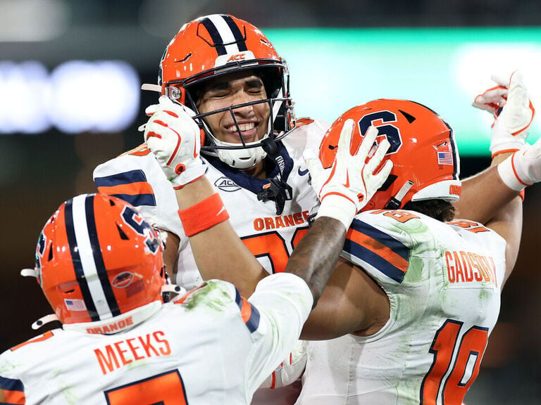 McCord's historic night helps Syracuse beat WSU in Holiday Bowl