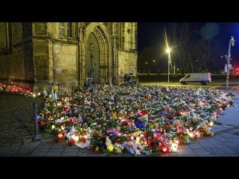 Candles and flowers flood makeshift memorial for Magdeburg market attack