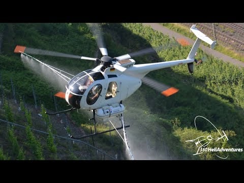 Amazing spraying action with MD500D helicopter