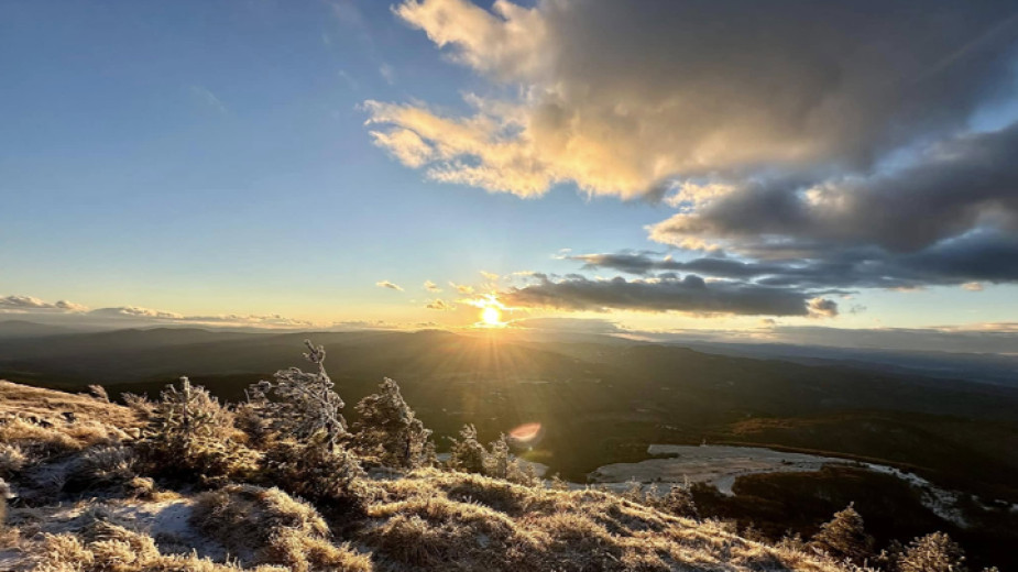 Tourists welcome the first sunset of the year on Lyubash Peak