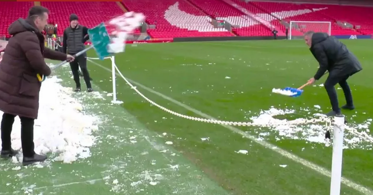 Gary Neville hilariously shovels snow back onto Anfield pitch ahead of Manchester United v Liverpool