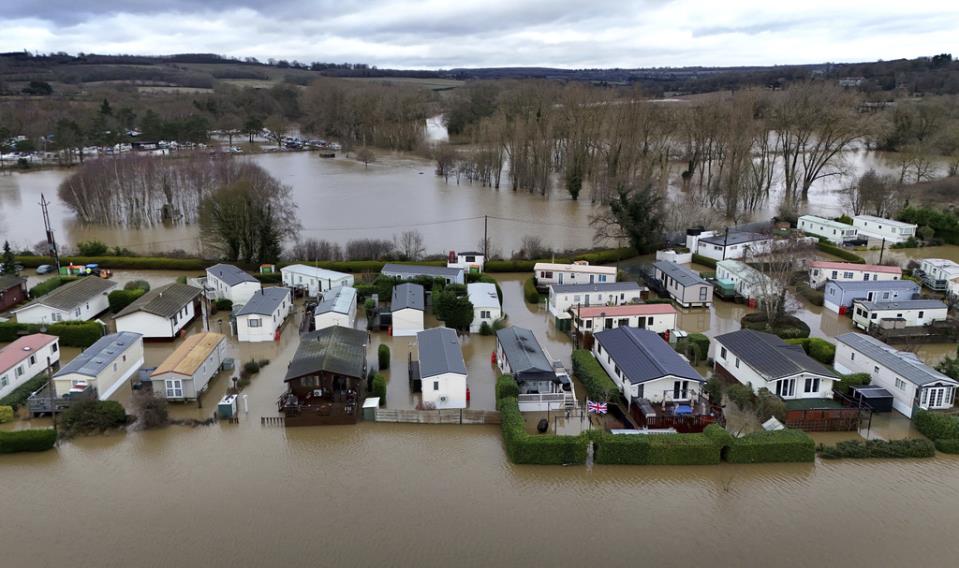 Dozens rescued as rain leads to flooding and travel is disrupted in parts of the UK