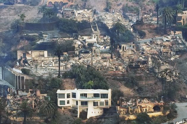 Firefighters make progress as two biggest fires in Los Angeles continue and ten dead 