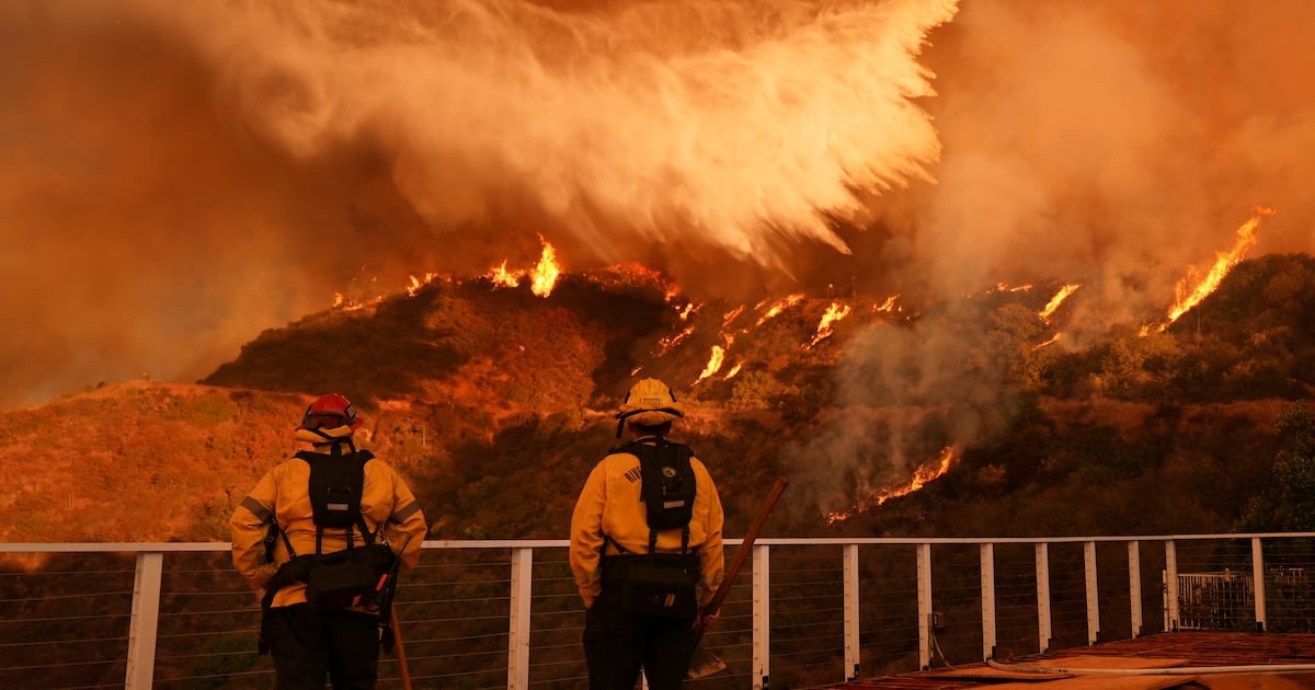 Firefighters race to contain LA wildfires as winds forecast to return