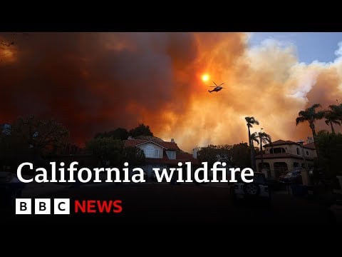 California wildfire rips through LA suburbs as 30,000 told to evacuate | BBC News